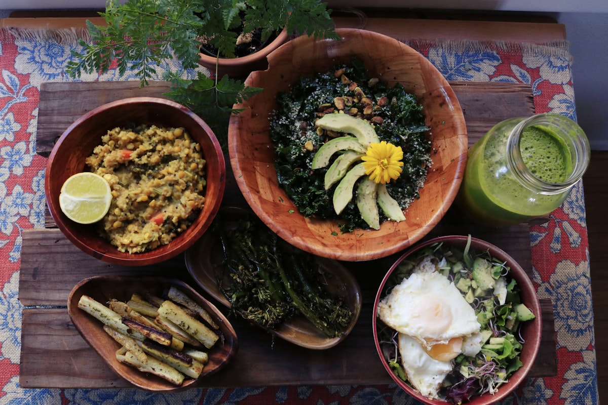Artfully plated green vegetable dish with herbs and seeds